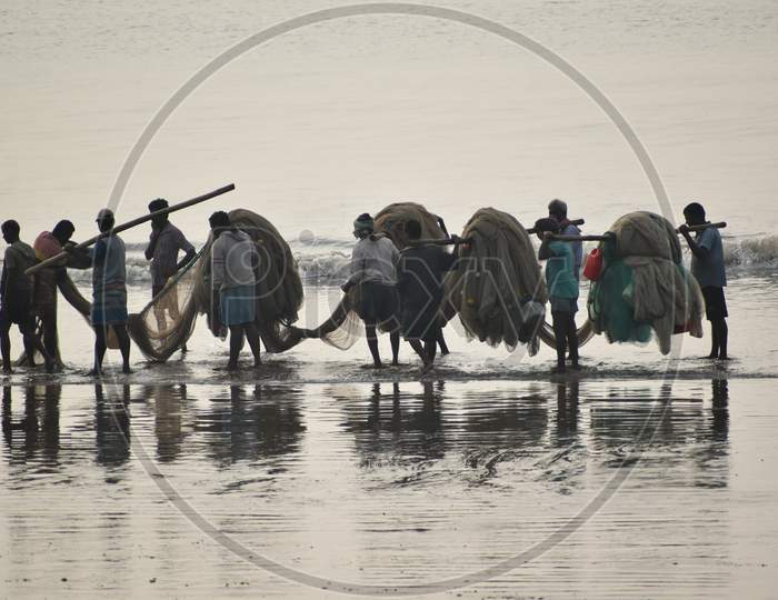 Groups of fisherman at Digha