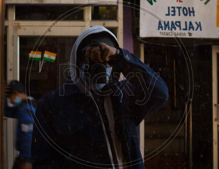 a man on a street with camera