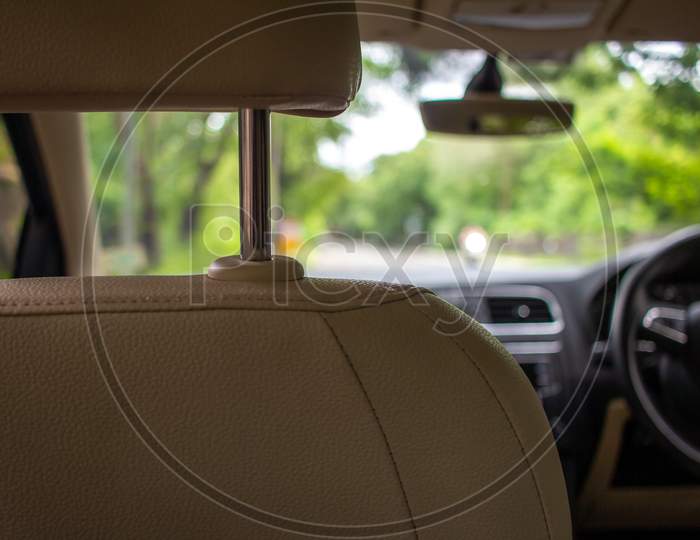 View Of The Car Interior And Dashboard From The Backseat