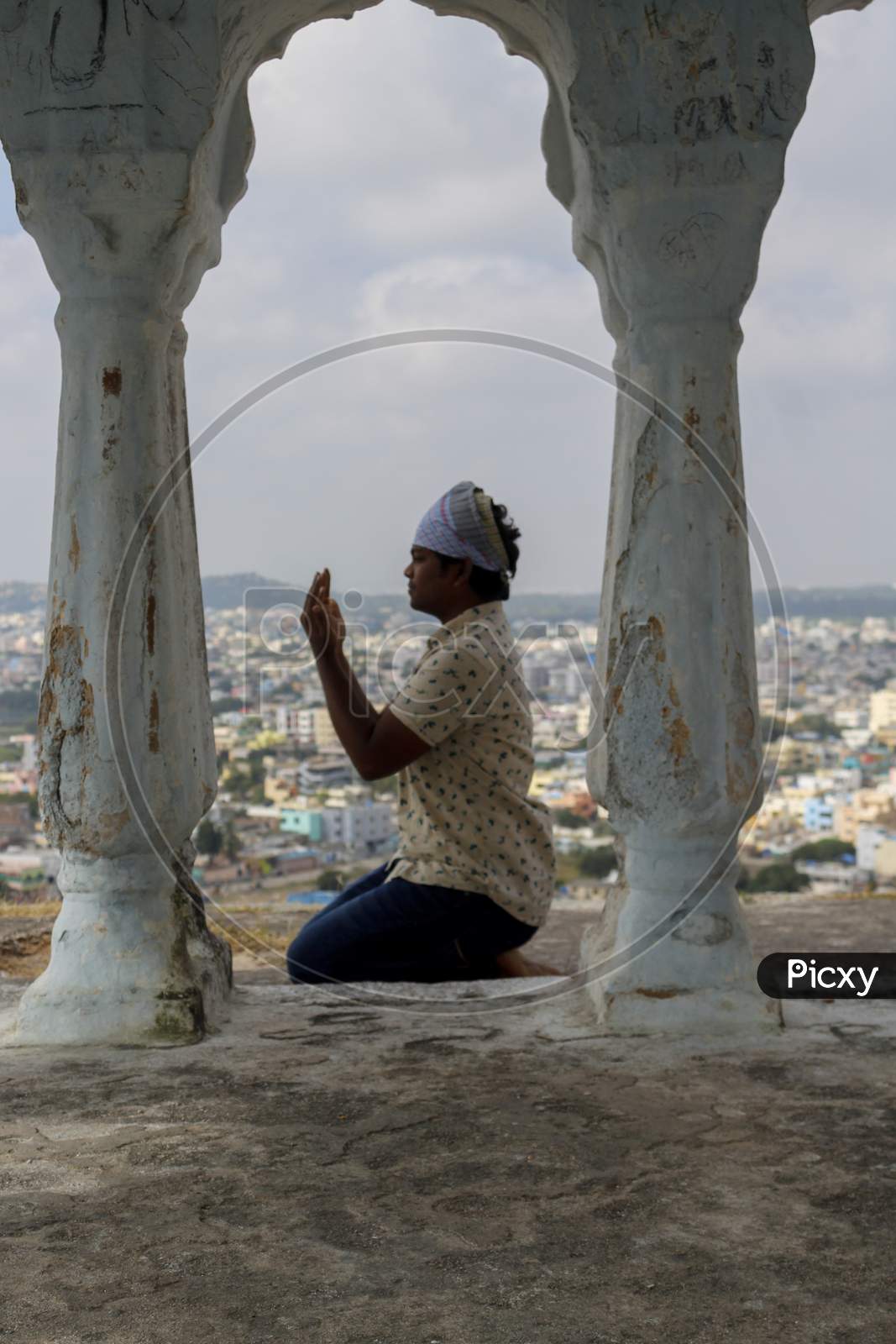 Image of Devotee offering namaaz at moula ali hill dargah-UN732227-Picxy