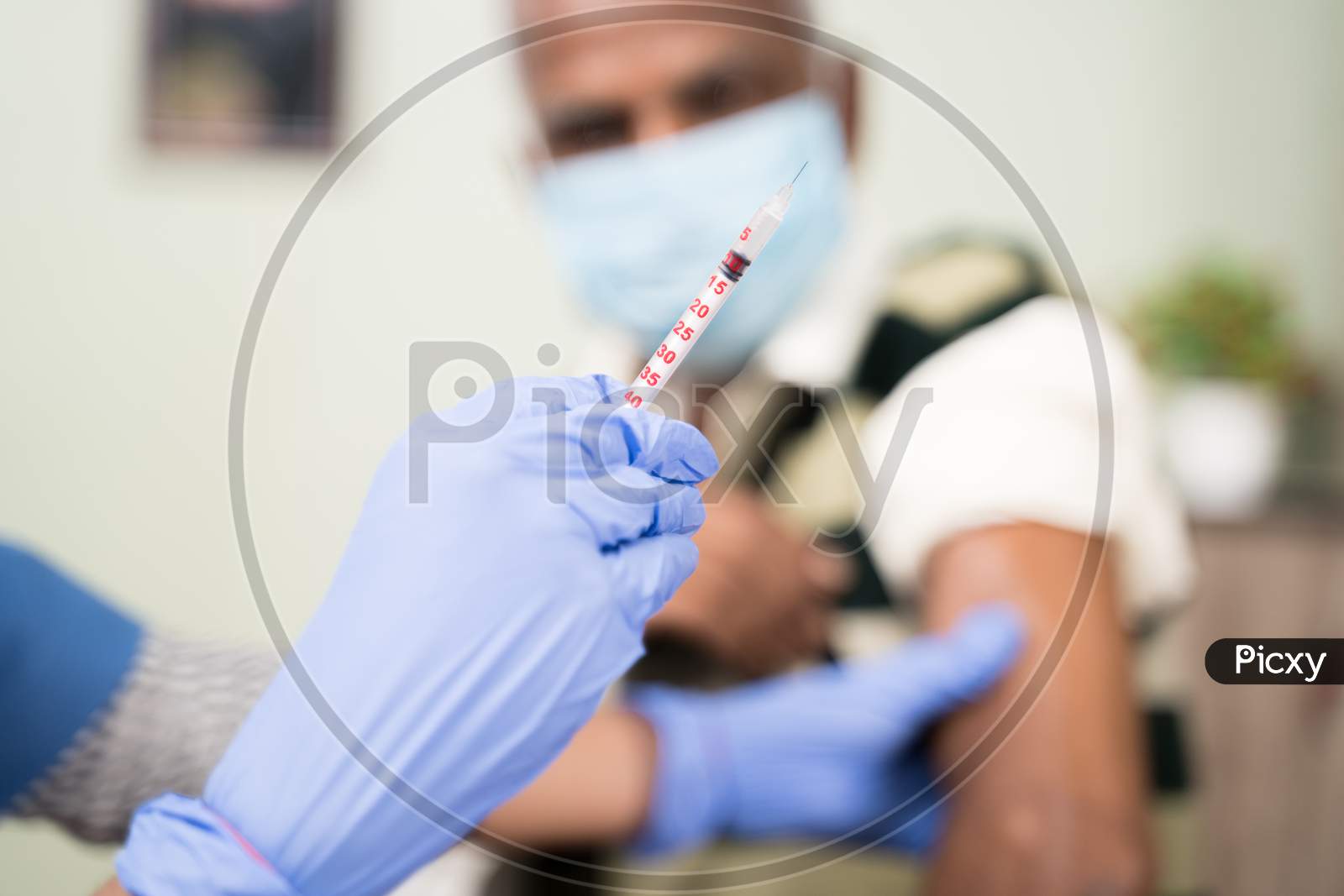 Selective Focus Of Doctor Hands Holding Syringe Vaccination Shot For Shoulder Of Patient At Hospital - Concept Of Coronavirus Covid-19 Vaccination.