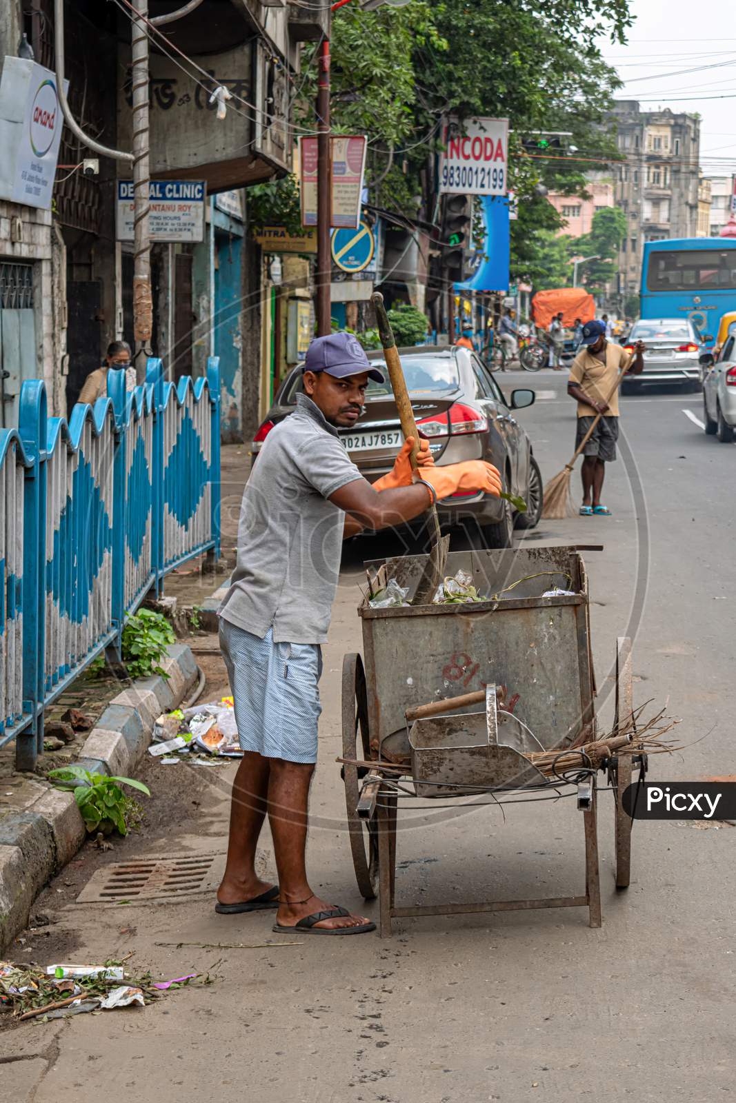 A Sweeper Sweeps The Street Of Kolkata, India On October 2020