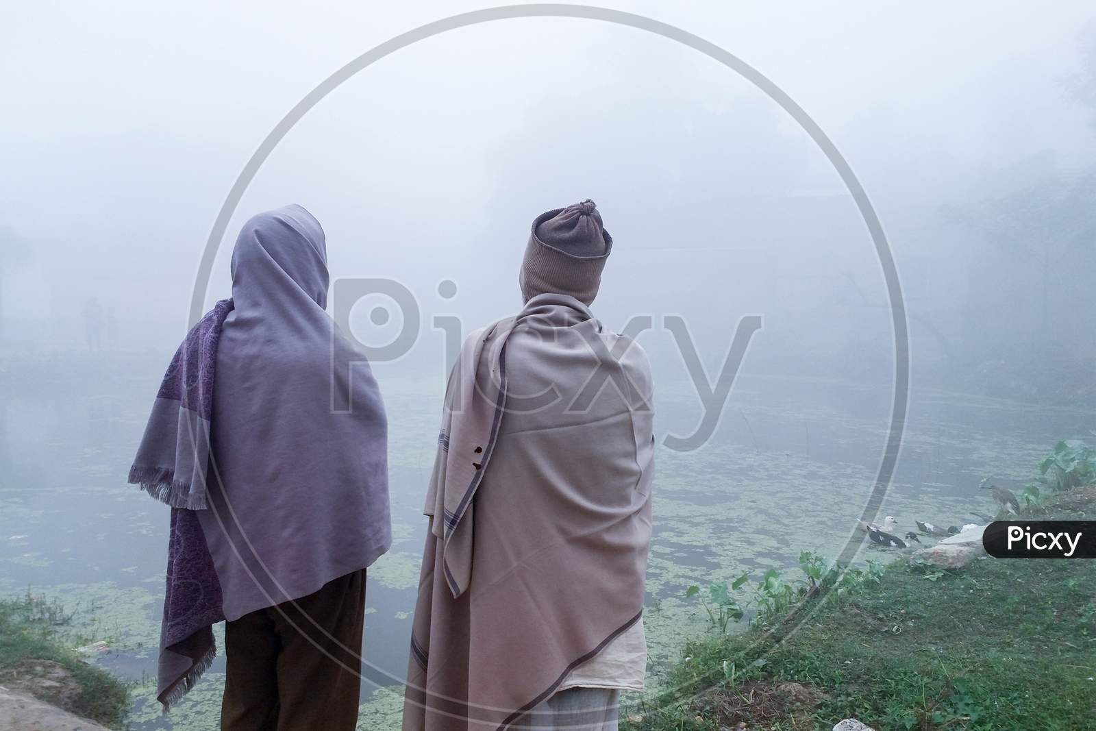 The Rural People Are Enjoying The Natural Beauty Of The Village In The Fog On A Winter Morning