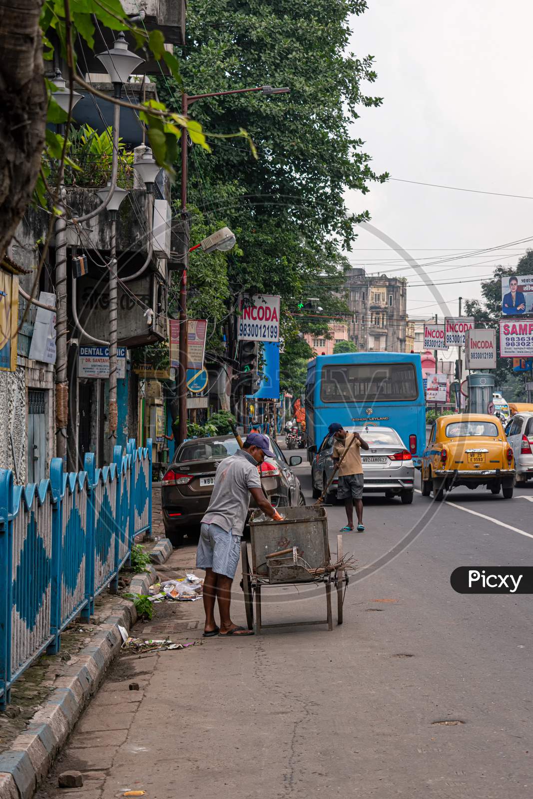 A Sweeper Sweeps The Street Of Kolkata, India On October 2020