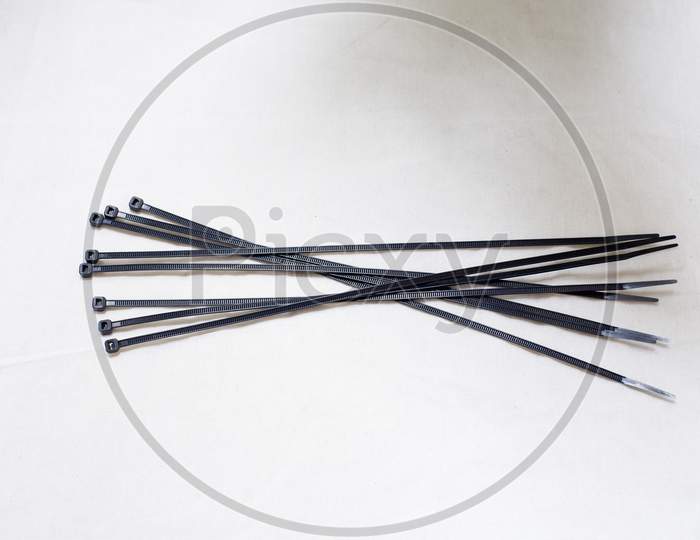 Cable Ties With A Black Color In A White Background