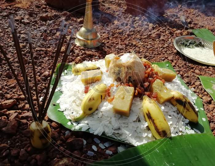 Traditional Hindu Pooja Dishes Over Banana Leaves