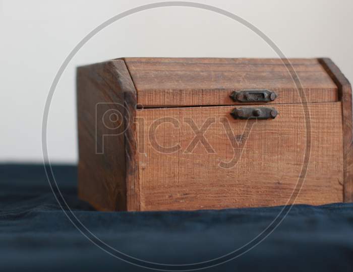 The wooden box on a table.