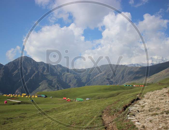 Campsite view in Himalayan meadow.