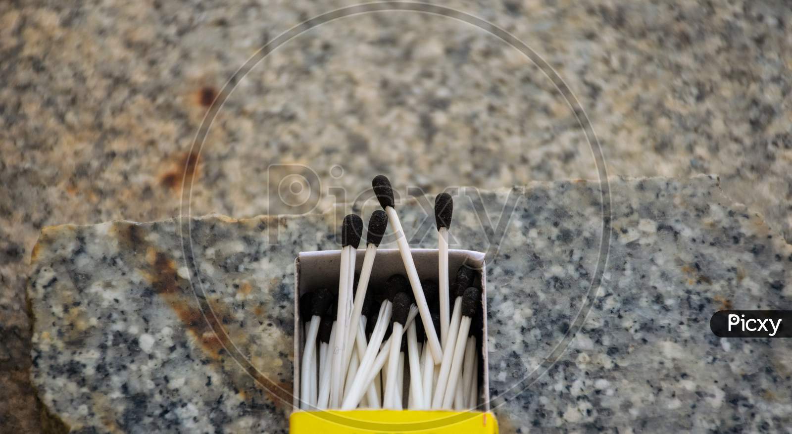 Image of Close Up Of Open Single Cardboard Match Box On Granite