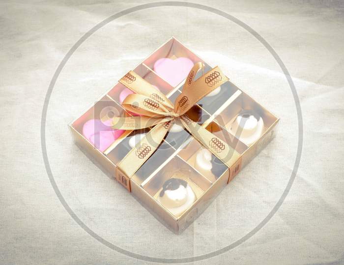 a chocolate box gift of various shapes for present