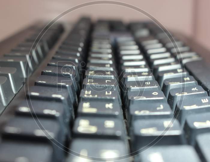 Closeup Of Laptop Computer Keyboard Black Keys With White Letters And Numbers