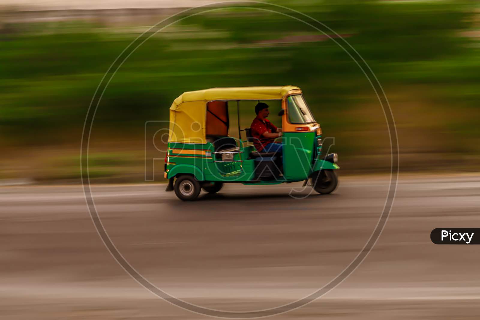 Auto rickshaw in motion