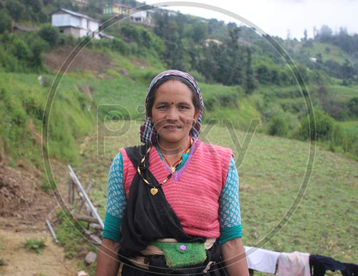 A rural himalayan lady wearing her traditional dress.