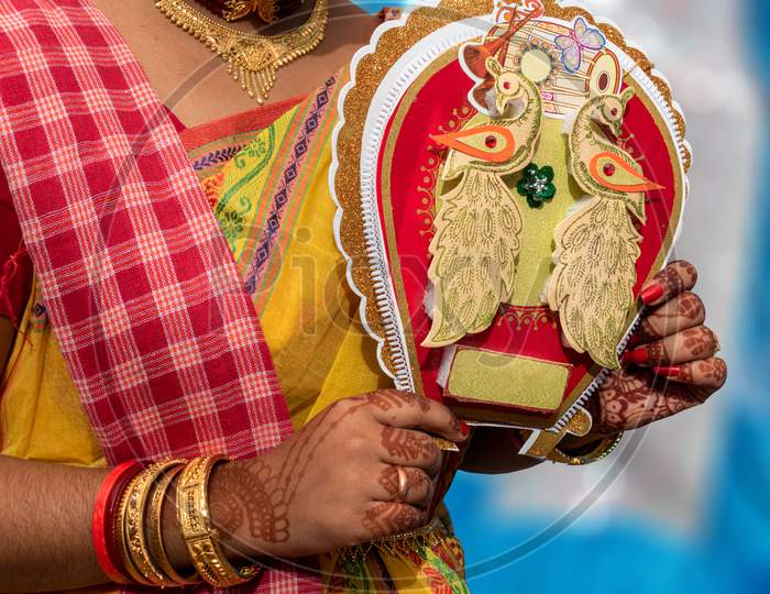 An Indian Girl Showing A Beautiful Handcraft