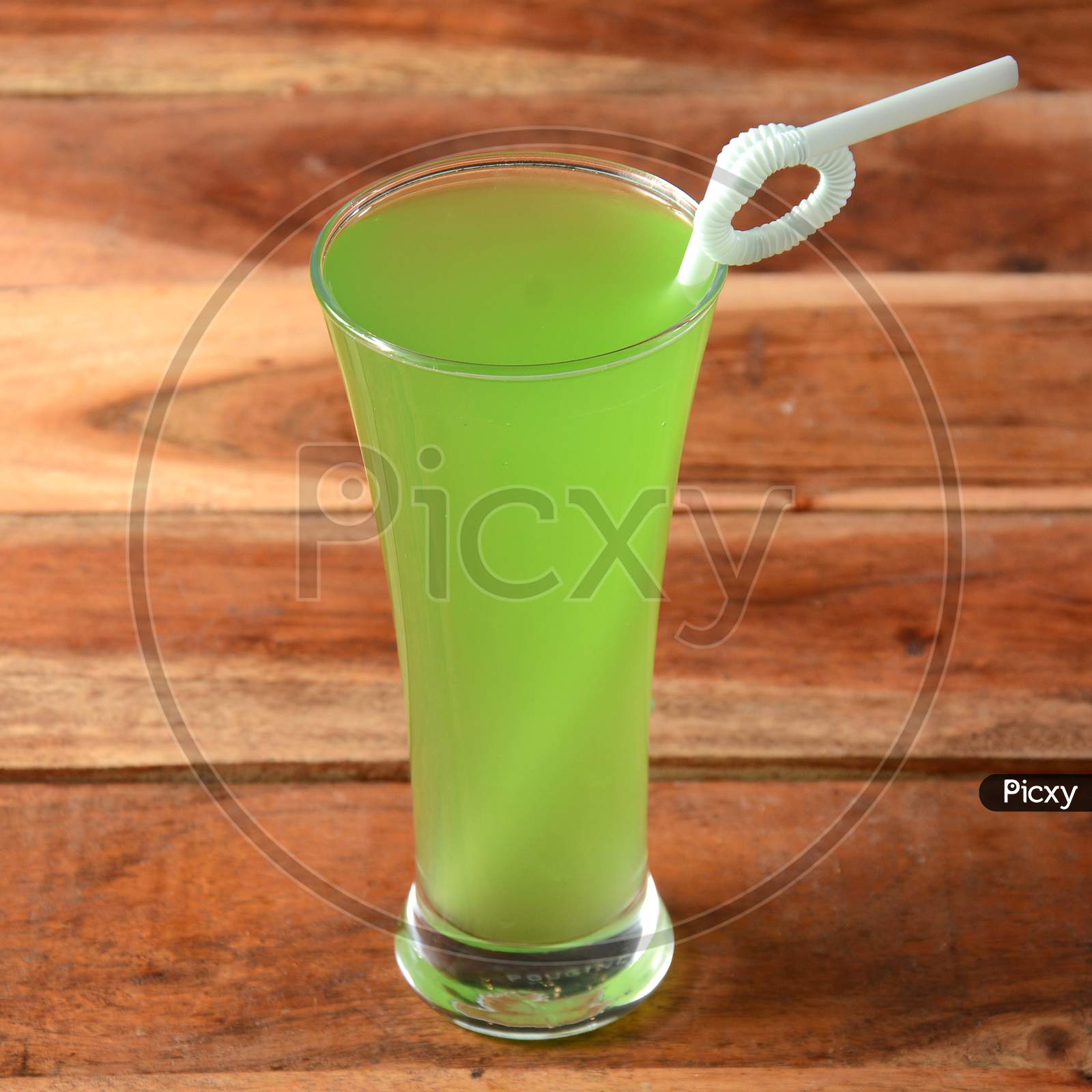 Green Apple Soda Served In A Glass Over A Rustic Wooden Background,A Refreshing Drink For Summer Days, Selective Focus On Top