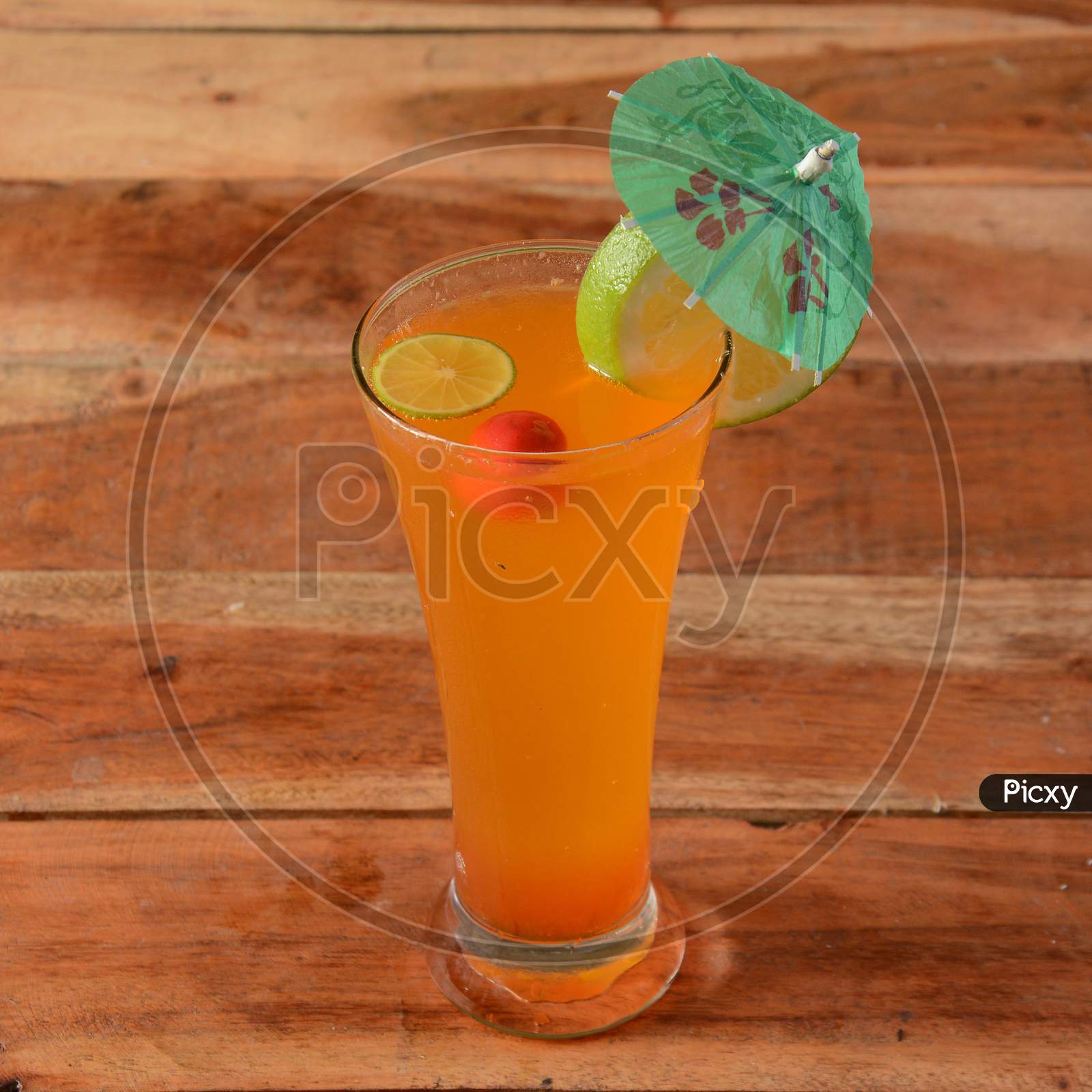 Orange Mojito Served In A Glass Over A Rustic Wooden Background,A Refreshing Drink For Summer Days, Selective Focus On Top
