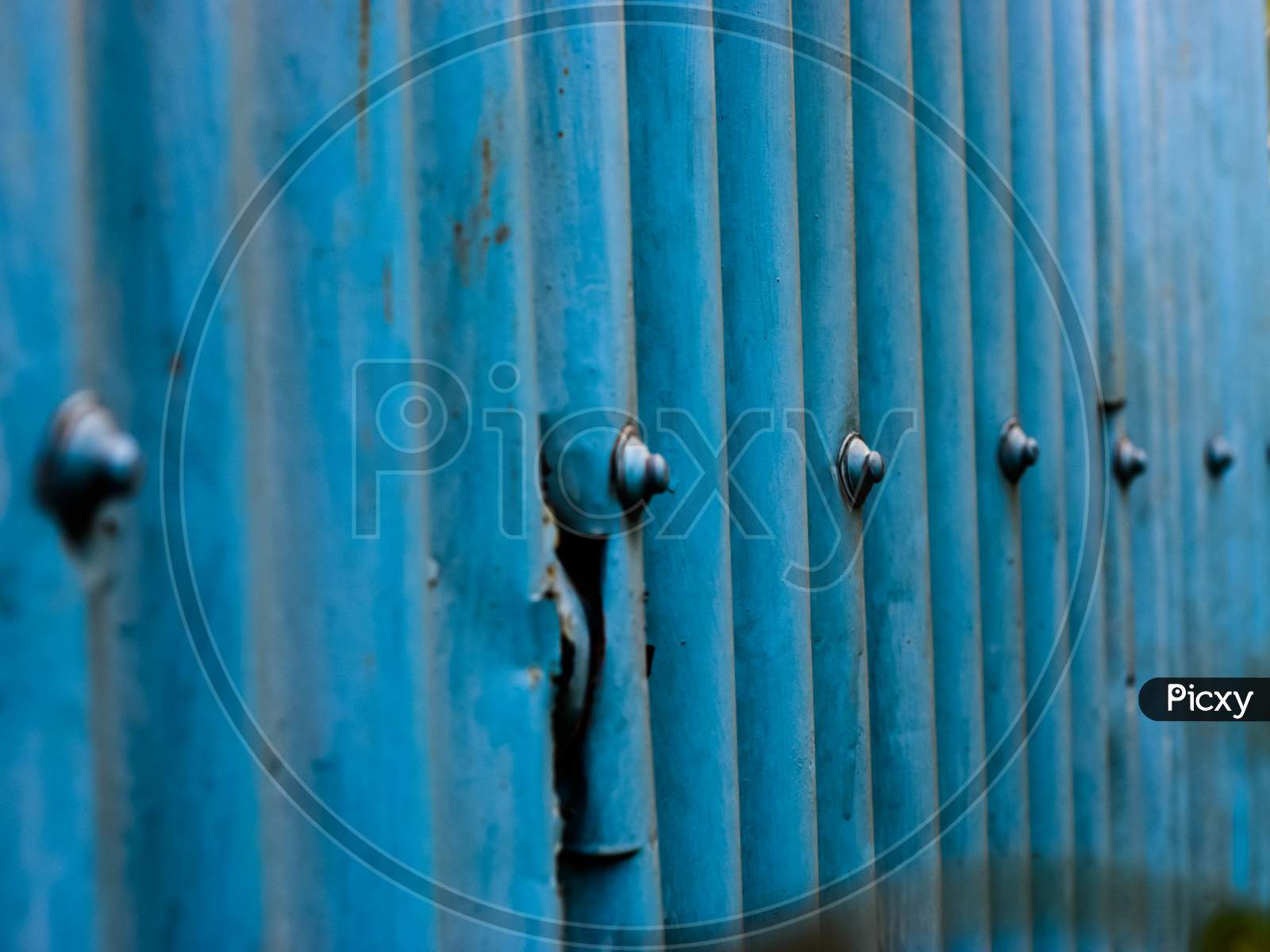 A Wall Made Of Corrugated Galvanized Iron (Gci) Sheet And Nuts(Edited)