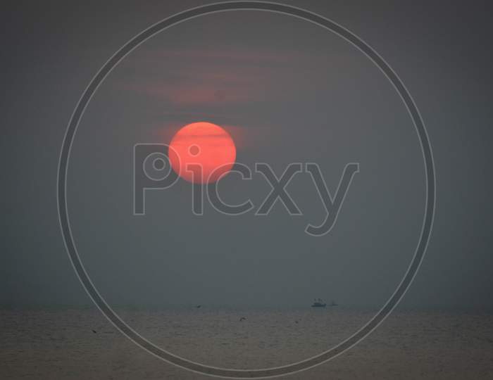 Sun Setting on the horizon at Palande Beach, Dapoli, Maharashtra, Indiali