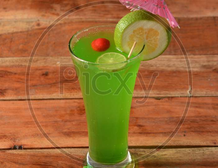 Lime Mint Cooler Served In A Glass Over A Rustic Wooden Background,A Refreshing Drink For Summer Days, Selective Focus On Top