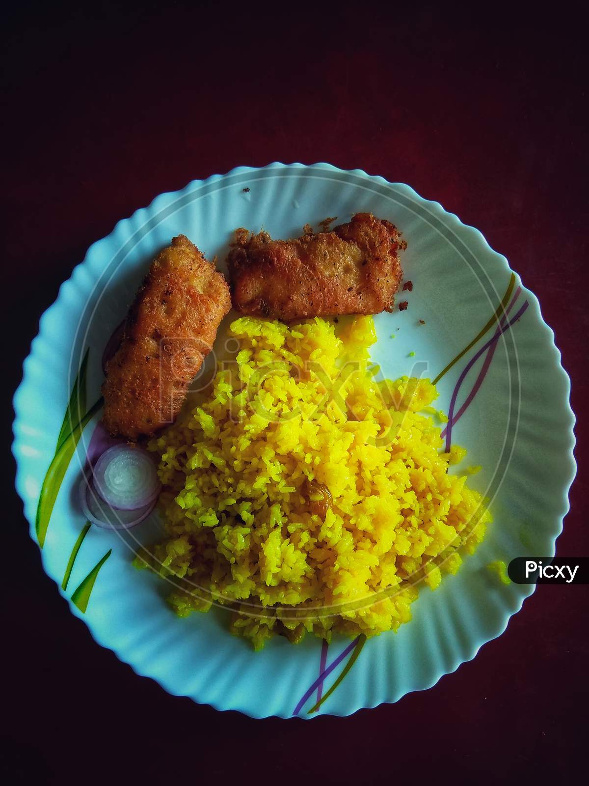 Indian Rice Dish Vegetarian Pulao In The White Bowl With Fish Butter Fry