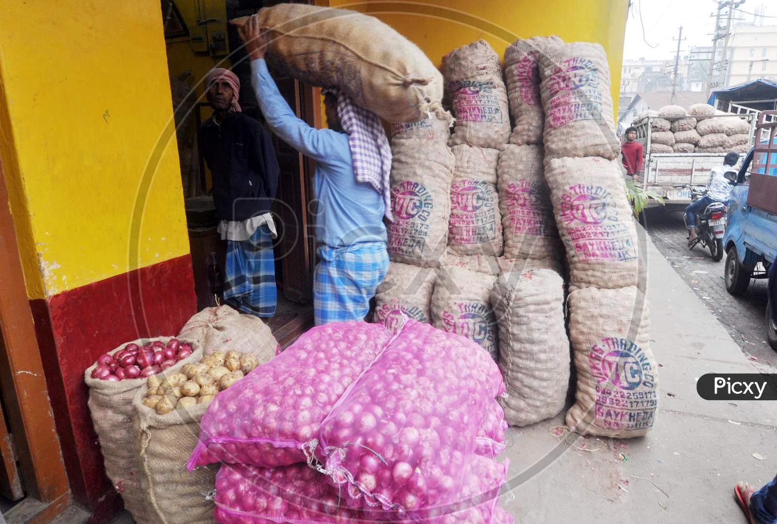 Guwahati: Workers Carrying Beside Sacks Of Potatoes And Onions At A Market In Guwahati, Saturday, Feb 1, 2020. Finance Minister Nirmala Sitharaman Presented The Union Budget In Parliament Today.