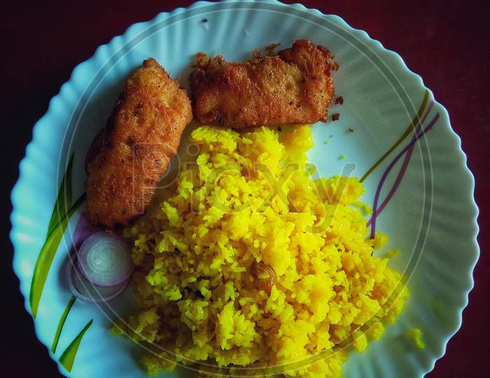 Indian Rice Dish Vegetarian Pulao In The White Bowl With Fish Butter Fry