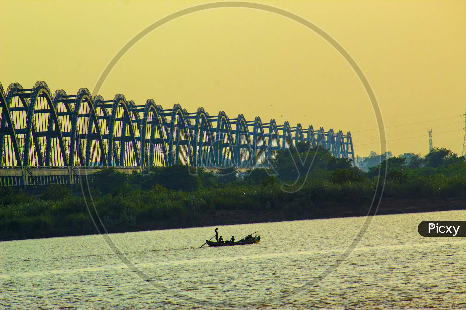 A Fisherman At Rajahmundry  Arch Bridge Over Godavari River