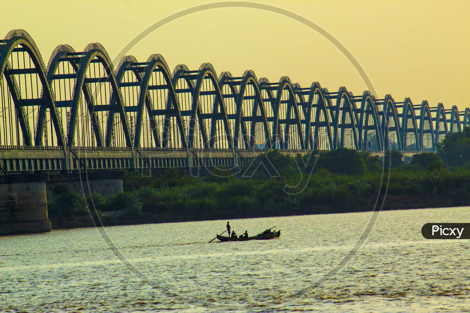 A Fisherman At Rajahmundry  Arch Bridge Over Godavari River