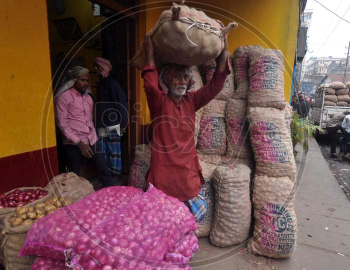 Guwahati: Workers Carrying Beside Sacks Of Potatoes And Onions At A Market In Guwahati, Saturday, Feb 1, 2020. Finance Minister Nirmala Sitharaman Presented The Union Budget In Parliament Today.