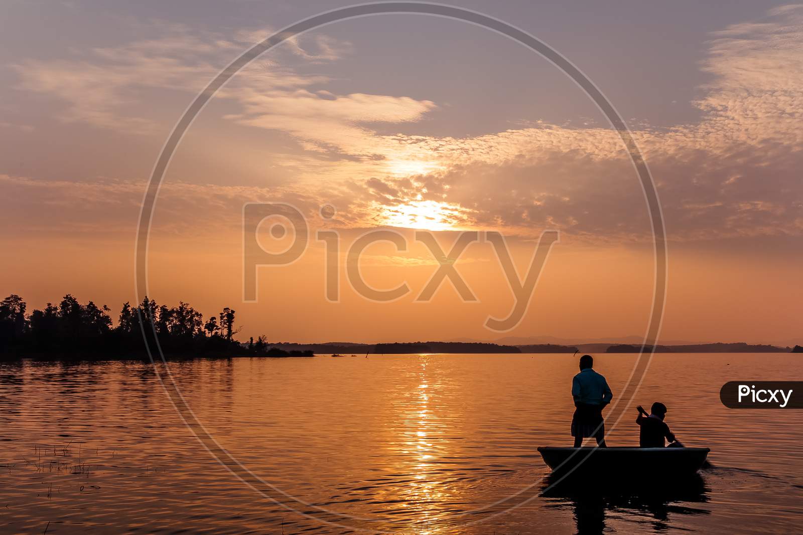 Fisherman at sunset on a coracle