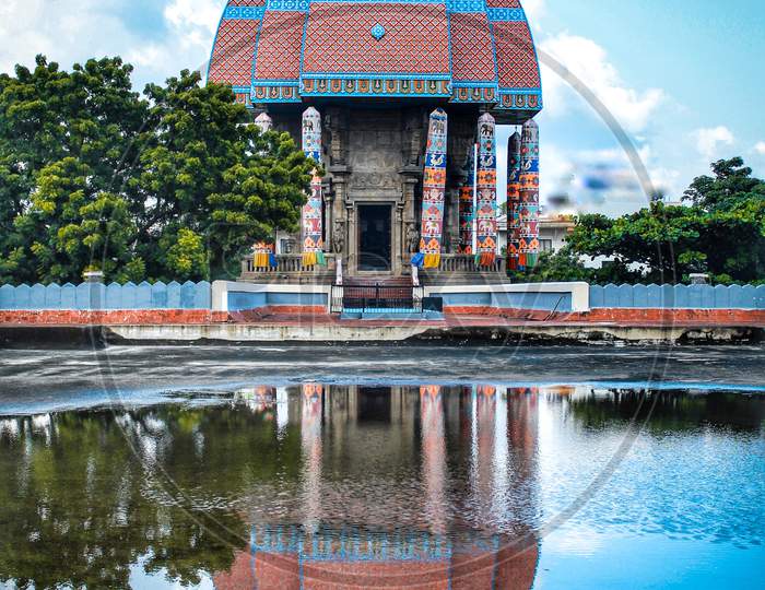 Reflection of an Temple Shrine In Water Surface