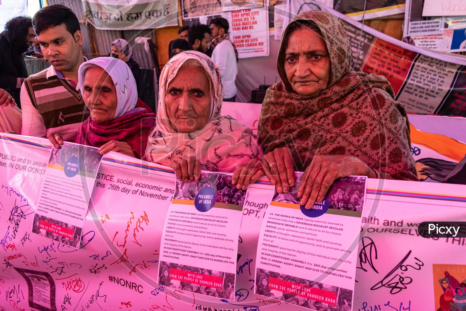Women from Shaheen Bagh holding preamble of constitution of India protesting against Citizenship Amendment Act Caa National Register Of Citizens Nrc And National Population Register Npr