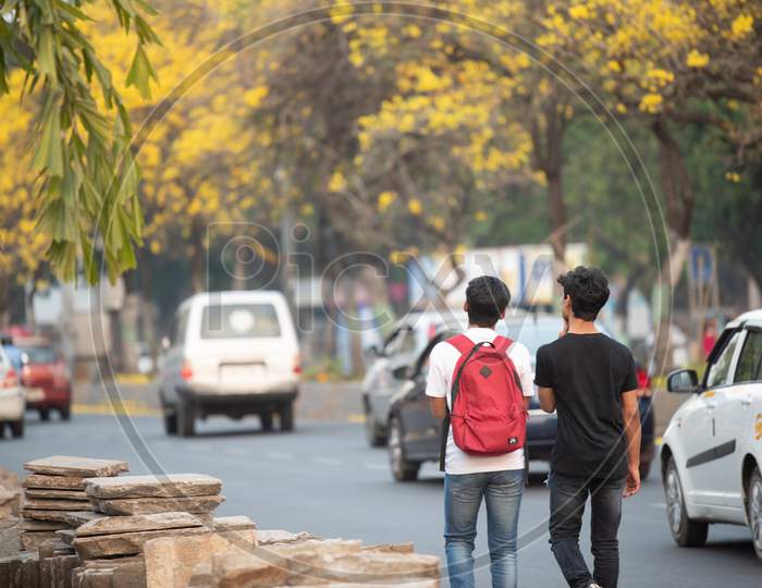 Indian boys walking on the road