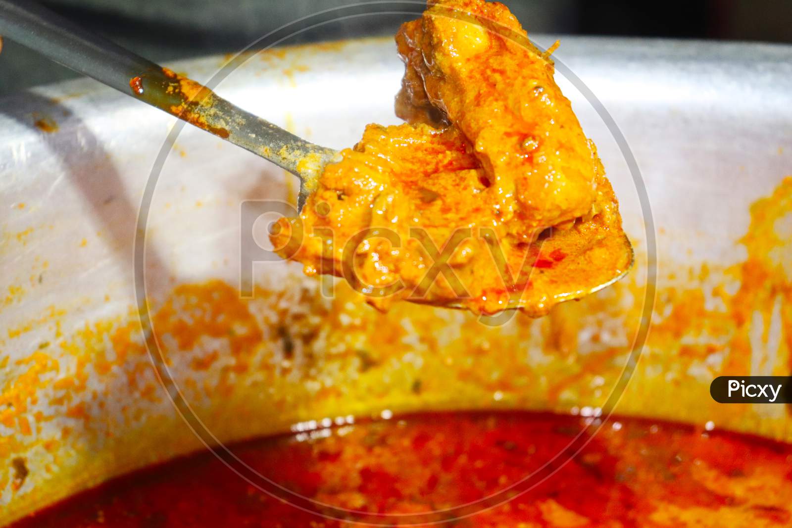 Indian spicy Chicken curry or masala chicken with single piece