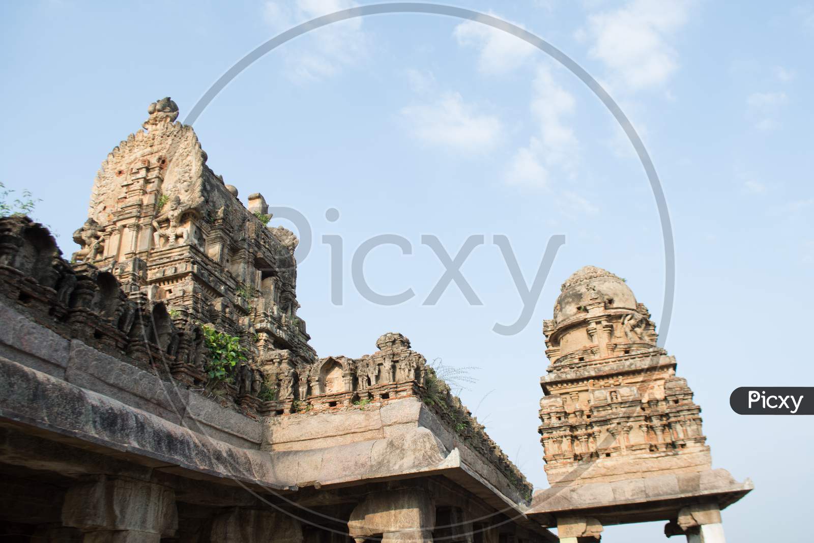 Architecture Of Ancient Hindu Temple With Stone Carved Temple Shrines