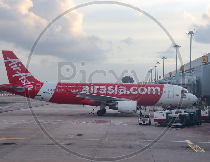 Air Asia Flights In an Airport Terminal At  Chiang Airport Singapore
