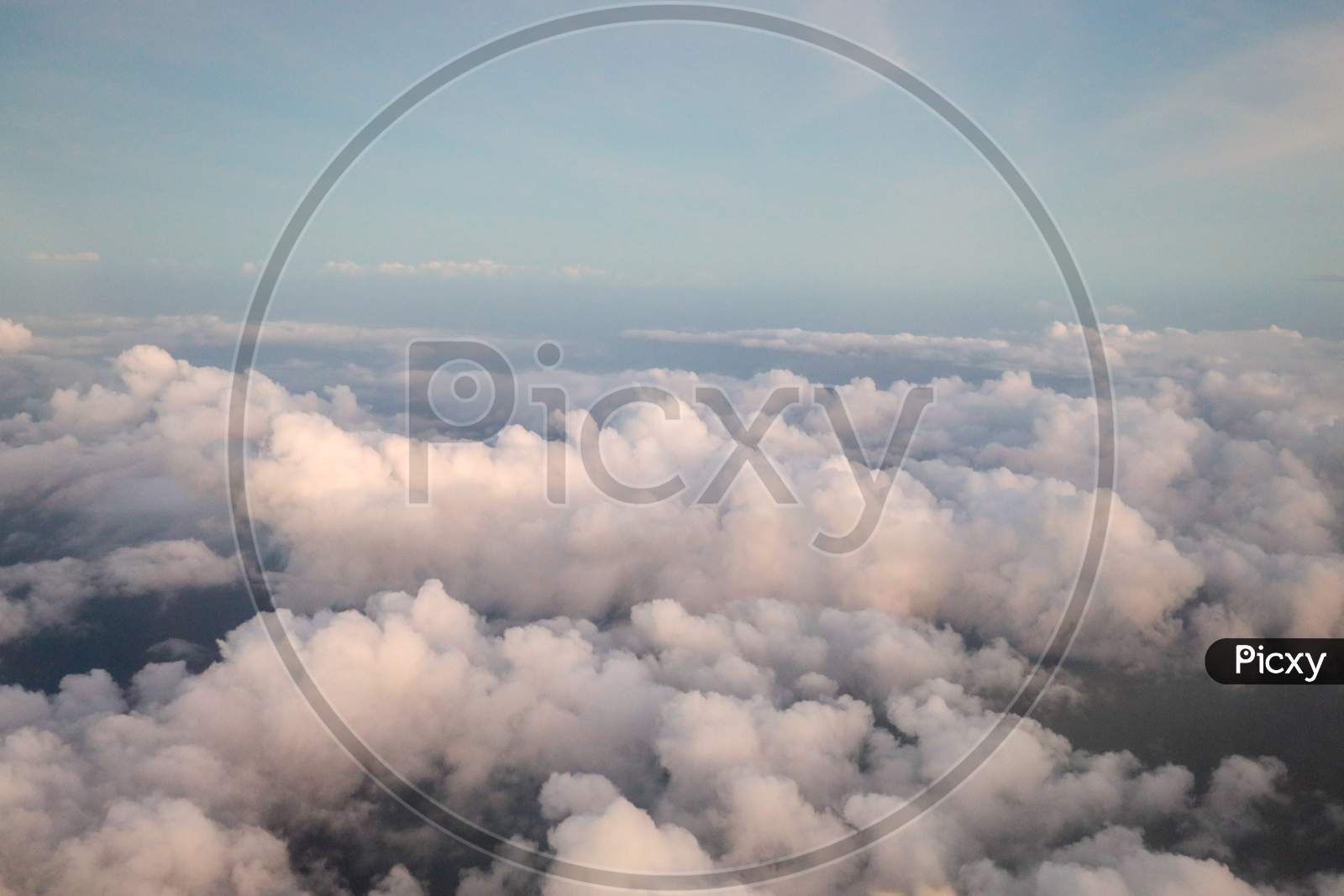 Cotton Clouds In Sky From  Flight Window