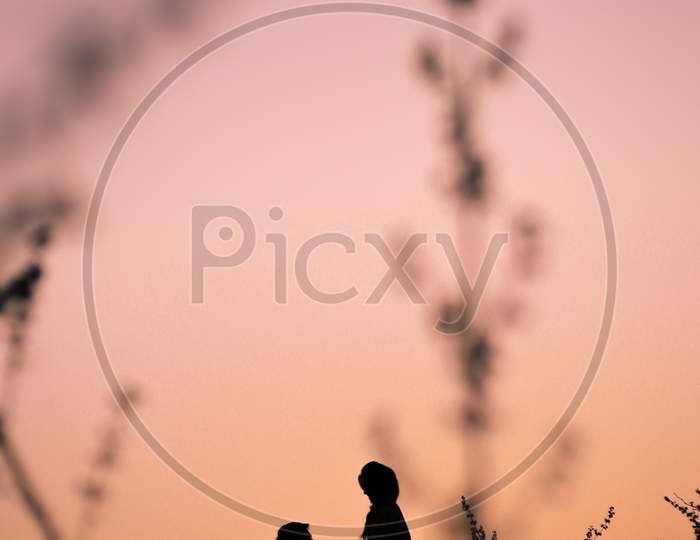 Silouette of Newly Married couple during sunset