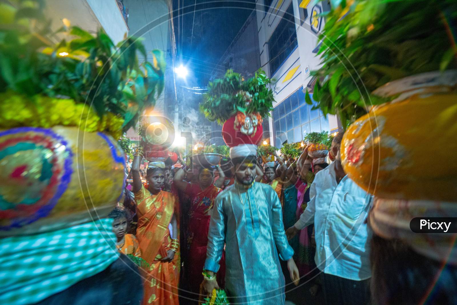 Devotees Carrying Bonam Over Their Heads At Bonalu Festival Celebrations in Hyderabad