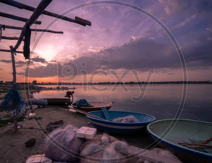 Landscape of fishing nets by the lake during sunset