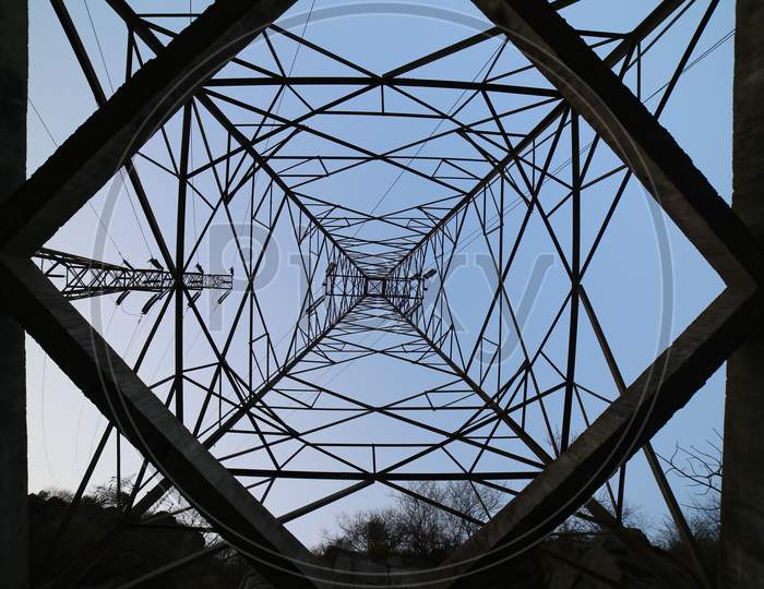 Canopy Of Electric High Tension Poles With Frames Silhouette