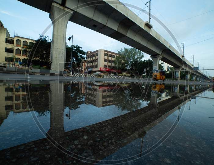 Reflection Of Metro Track And Pillars on an Water Surface
