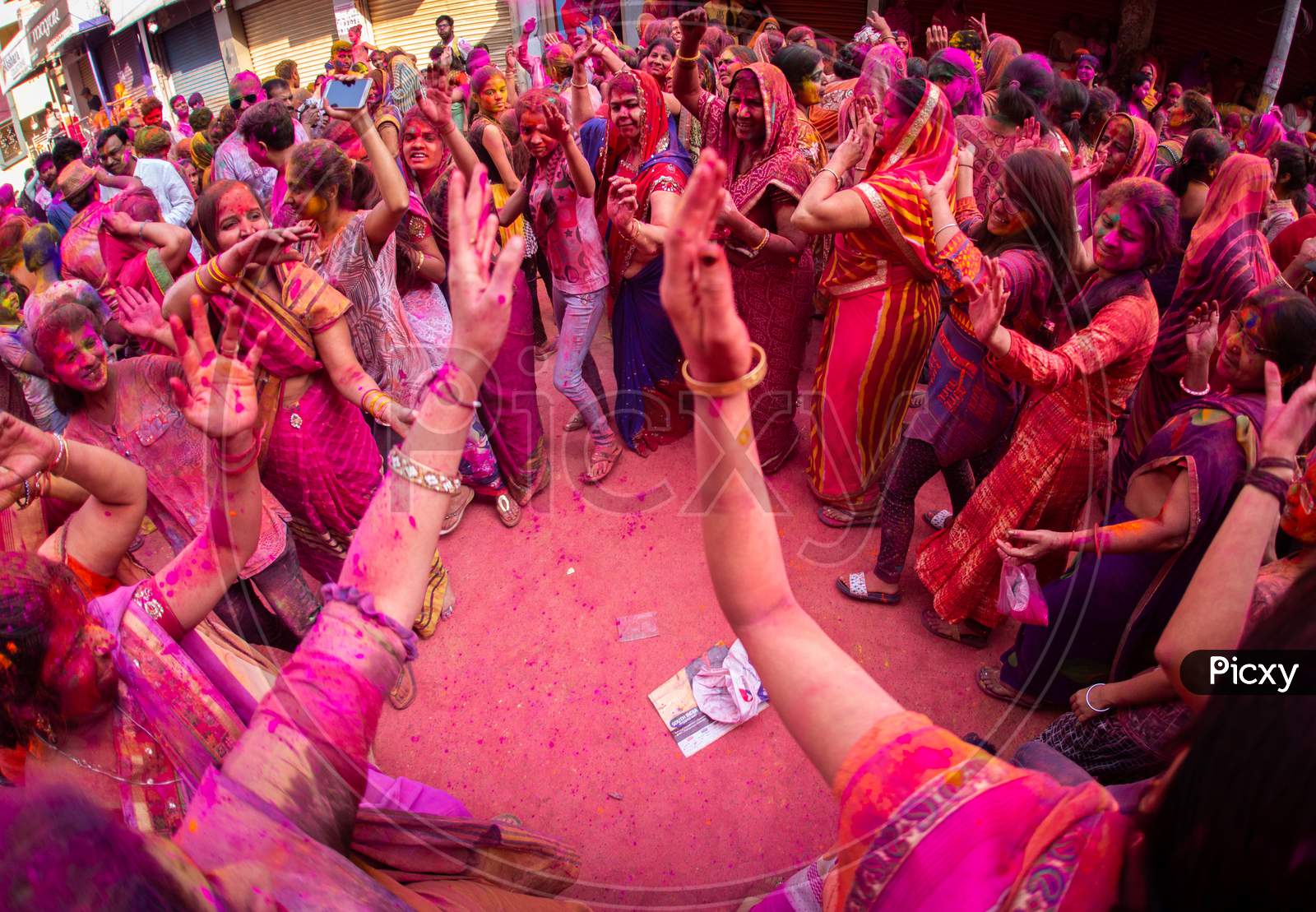 Indian girls dancing during Holi Festival