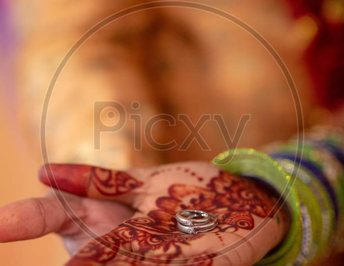 South Indian Wedding Couple Holding  Wedding Rings Closeup Of Hands
