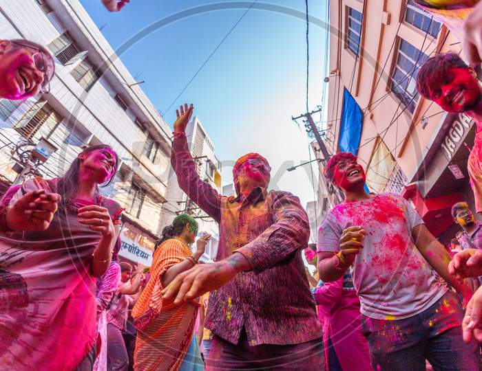 Indian people cheering during Holi Festival