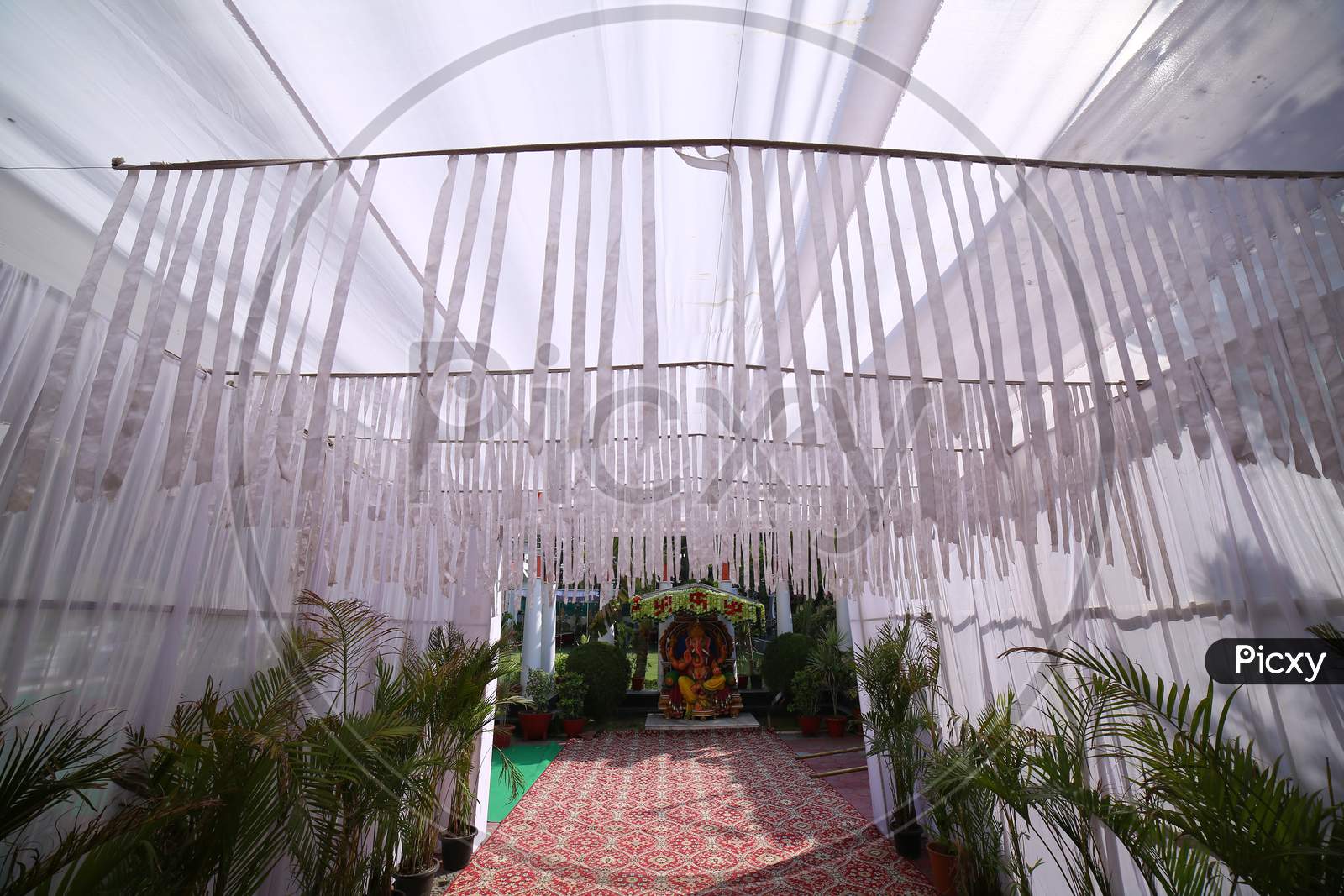 Decorated Stages With Fresh Blooming Flowers At Indian Wedding Ceremony