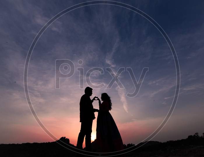 Silhouette of a couple during sunset