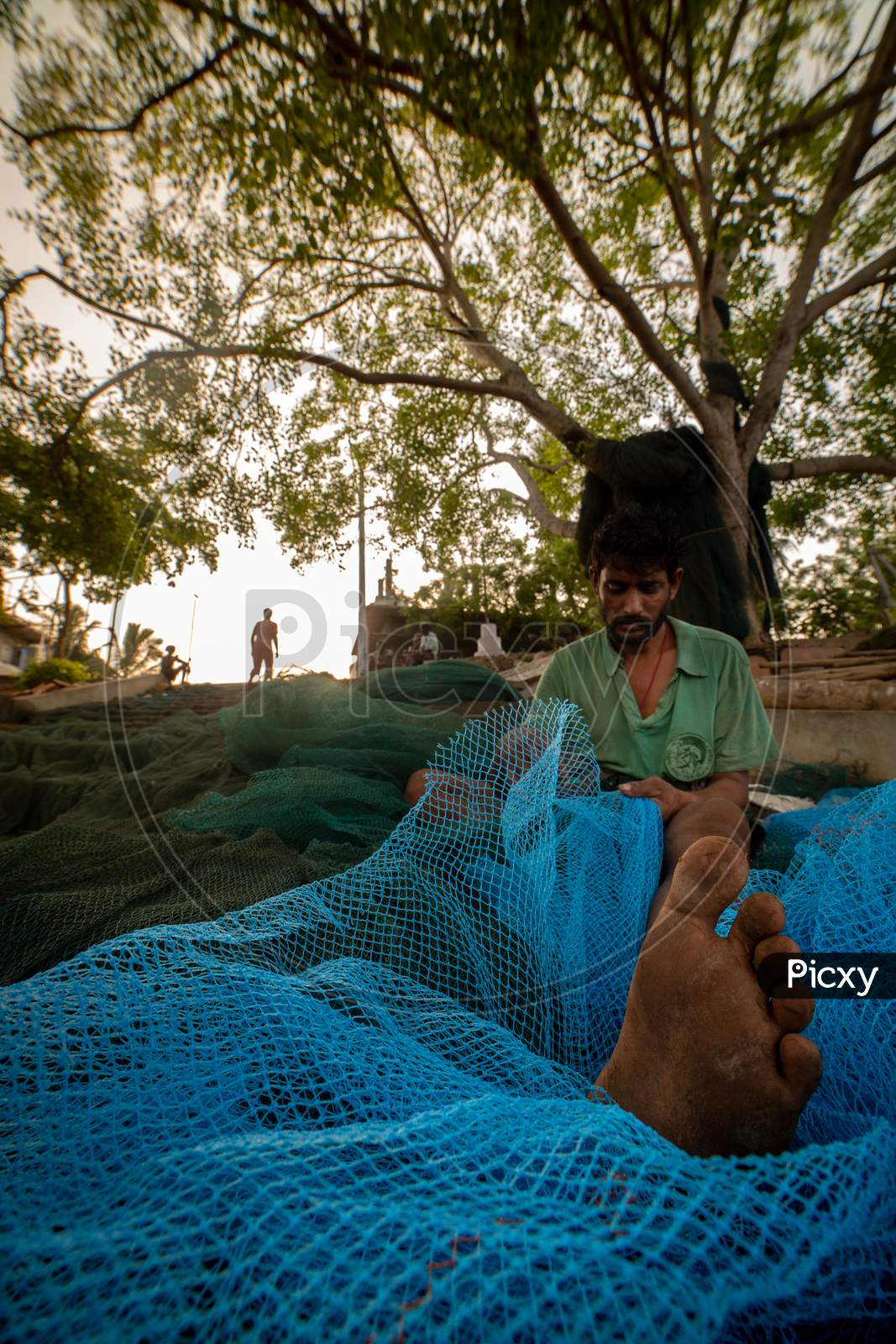 Indian fisherman setting cast net