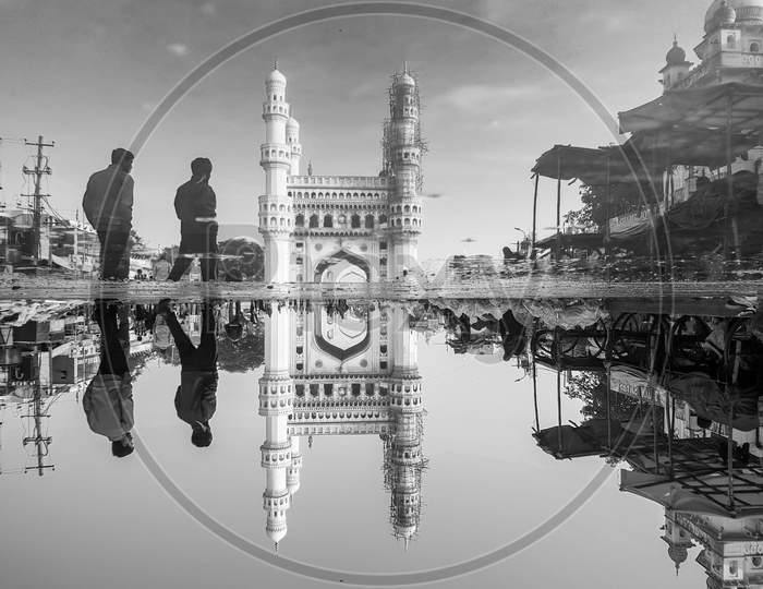Reflection of Charminar in the puddle water