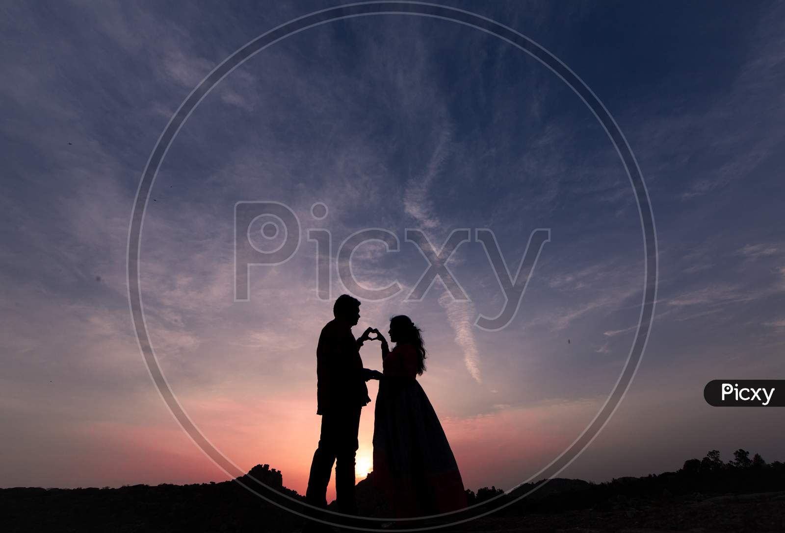 Silhouette of a couple during sunset